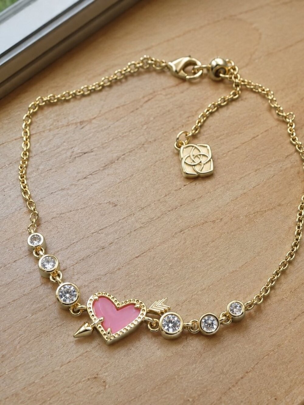 Kendra Scott Ari heart arrow tennis bracelet gold pink opalescent resin